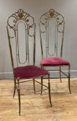 A pair of modern Continental brass side chairs, scrolled decoration to top over deep purple fabric