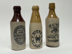 A collection of early 20th Century two-toned stoneware brewery bottles comprising a Dunbar & Co of