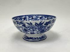 A late 19th Century Wedgwood blue and white pedestal punch bowl decorated with budding flowers