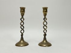 A pair of brass spiral stem table candlesticks on circualr domed bases: h. x 21.7cm