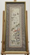 A framed Chinese silk work panel depicting a Garden Pagoda setting, in various coloured threads,