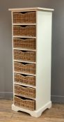 A modern painted pine storage unit, fitted with eight wicker baskets: H. 144cm L. 45cm D. 43cm