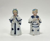 A pair of Victorian Continental porcelain blue, white, and gilt nodding figures of a lady and a