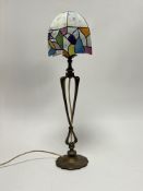 An Art Nouveau Tiffany-style Mid 20th Century table lamp with brass twist stem and shaped base,