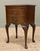 A reproduction mahogany bedside table, fitted with slide over two drawers to front, raised on