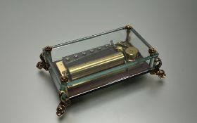 A contemporary Reuge Music Switzerland, the mechanism under a glass cover, playing Watermusic (