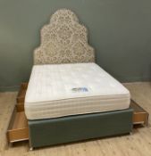 A contemporary headboard and divan base, headboard of arched form with scrolling foliate