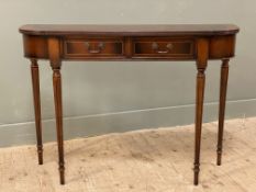 A reproduction inlaid mahogany console table, bow front with crossbanded top over two frieze