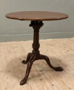 A George III mahogany tilt-top tripod table, circular top on bird cage and central baluster