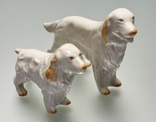 A graduated pair of Belleek Irish Settlers, both marked verso. (tallest h-13cm smallest h-10cm) (2)