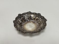 A Victorian Edinburgh silver pierced rose, thistle and clover leaf nut dish with engraved central