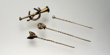 A 9ct gold horn, crop and horseshoe brooch missing pin: l. x 4cm 1.7g, togther with a yellow metal