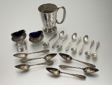 An Edwardian pair of Birmingham silver navette-shaped chased salts with original bristol blue
