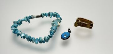 An Edwardian yellow belt and buckle scarf ring: l. x 2.1cm 4.9g together with a turquoise bead