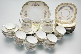 A Noritake floral garland with green / or gold scrolling foliate edge pattern part tea services