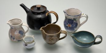 A collection of Studio Pottery comprising, an Orkney light blue with green glazed edge small pot (