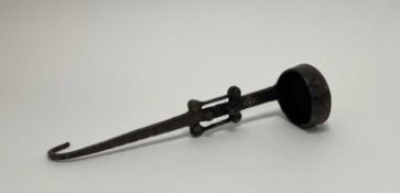 A 20th Century ladel in the Tibetan style, with brass studs to handle (l. 32cm)