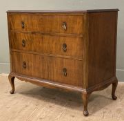 A 1930s walnut veneered chest of drawers, moulded top over three graduated drawers to front,