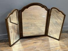 An early 20th Century trifold mahogany vanity dressing table mirror, the central panel with hinged