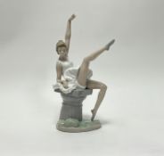 A Lladro NAU ballerina figure, raised on a grey plinth of column form, Daisa 1980 (h. 34cm)