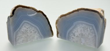 A pair of Agate Geode paperweights/ bookends, slight chip to one. (h-10cm) (2)