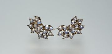 A modern pair of 9ct gold facet cut moonstone stud earrings: l. x 2cm 5.39g