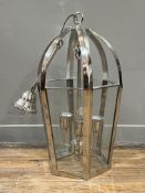 A modern hanging lantern of faceted, hexagonal form, chrome finished metal with clear glass panels