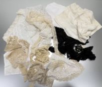 A collection of Victorian and later vintage lace comprising black lace trimmings, lace collars