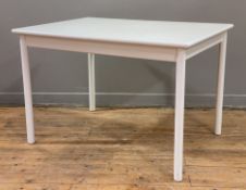 A modern hardwood extendable dining table, white-painted rectangular top with extra leaf raised on
