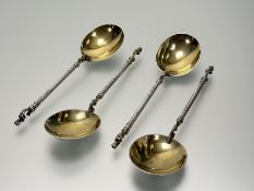 A Victorian Henry Holland London set of four silver gilt renaisance revival serving spoons with