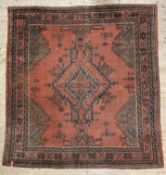 A hand-knotted Turkish Oushak rug, central medallion surrounded by geometric patterns and enclosed