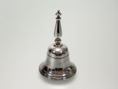 A London silver table bell with baluster knop handle and silver clapper: h. x 11cm d. x 6cm London