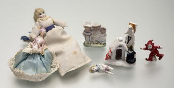 A collection of charming bisque hand painted porcelain figures comprising, a trio of children in
