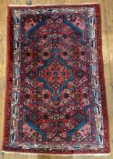 A hand-knotted Persian Zanjan rug, central medallion within a field of stylized flowerhead and