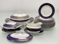 A Wedgwood Imperial Porcelain colbalt enamelled edge with gilt foliate pattern part dinner service