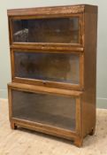 An early 20th century sectional bookcase by Globe Wernicke, three sections with glazed up and over