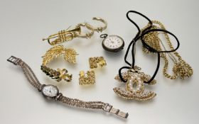 A collection of gilt metal costume jewellery to include a pair of hoop riveted C earrings, a paste