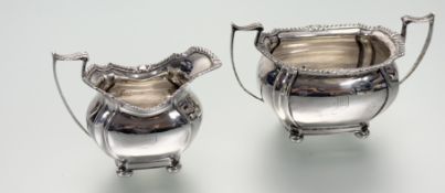 A Sheffield silver two-handled sugar basin with gadroon border and panel sides with engraved initial