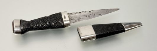 A Sterling silver mounted Skian Dubh with bog oak carved celtic handle set with citrine glass