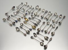 A large collection of continental and eastern white metal tea spoons to include a set of six