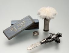 An Early 20thc silver teething rattle toy in the form of a bear with a mother of pearl tip,