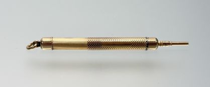 A Tiffany & Co 14k stamped gold propelling pocket book pencil with engine turned decoration: l. x