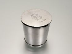 A continental white metal tapered beaker with lift up top with engaved intials C.B July 14th 88