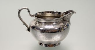 A Victorian London Goldsmiths Alliance Ltd Cornhill London silver milk jug with engraved ivy leaf