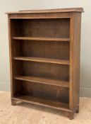 An early 20th century pine open bookcase, ledge back over three adjustable shelves to front,