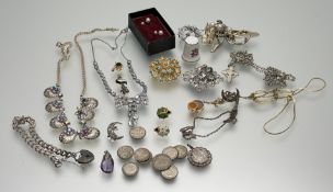 A collection of costume and silver jewellery to include a silver curb link chain bracelet with heart