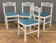 A set of four modern hardwood dining chairs, arched tops with blue drop-in seats, raised on turned