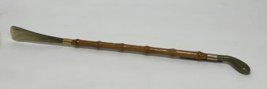 A 1960s shoehorn with faux-bamboo and resin handle and end (l. 54cm)