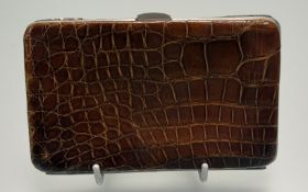 An Edwardian silver mounted crocodile skin wallet, Birmingham 1902, maker Charles Penny Brown,