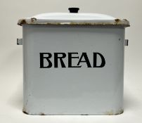 A vintage white enamel bread bin with twin handles and 'BREAD' inscribed to front (h. 34cm x w.